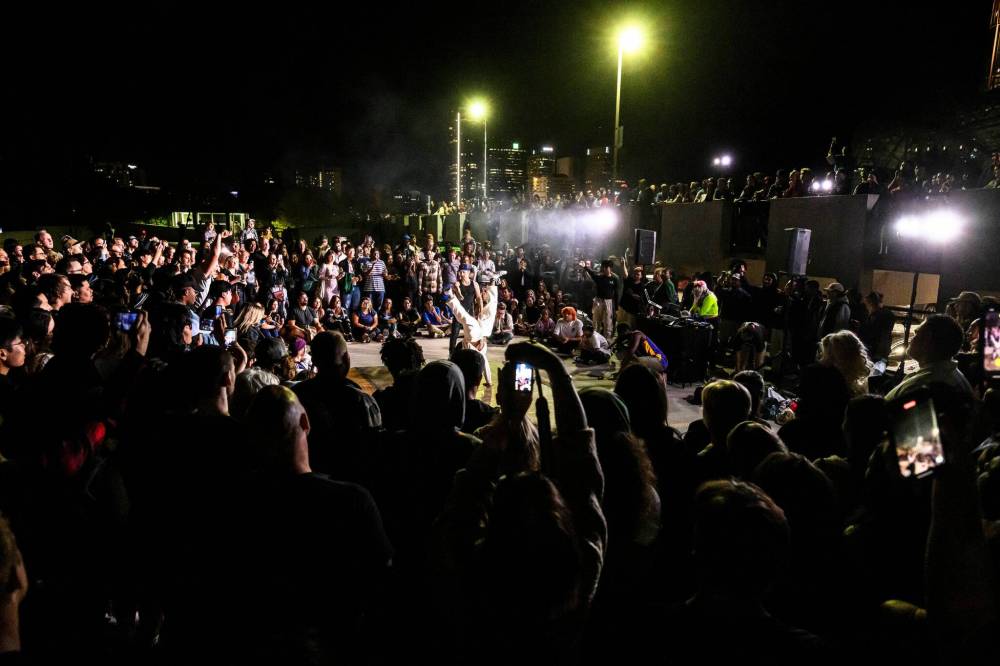MIKE SUDOMA / FREE PRESS
Hundreds of Nuit Blanche attendees take in the Light it Up Freestyle Dance Battle on top of The Forks parkade Saturday night.