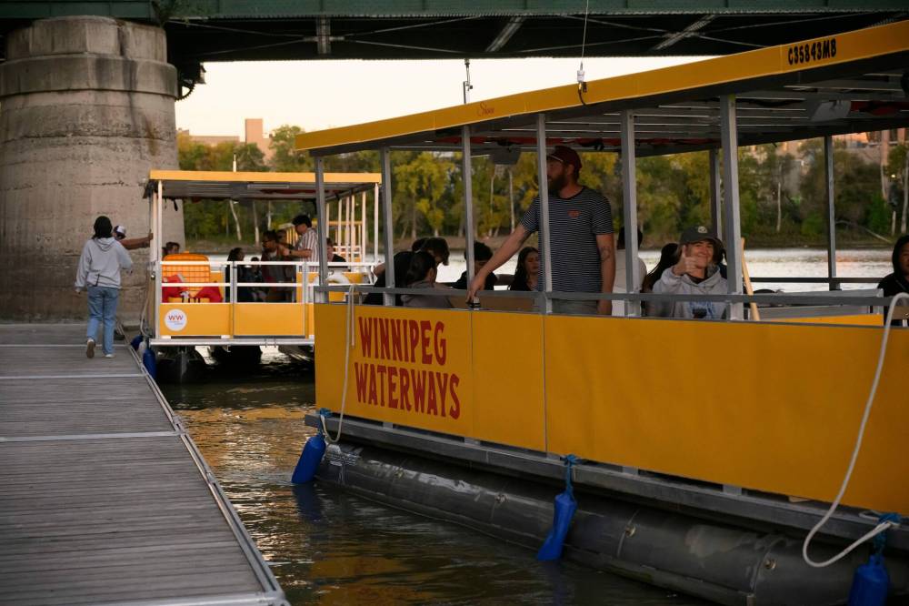 MIKE SUDOMA / FREE PRESS
The water taxis were in high demand Saturday night as Nuit Blanche festivalgoers enjoyed free rides to multiple locations from downtown to The Forks.
