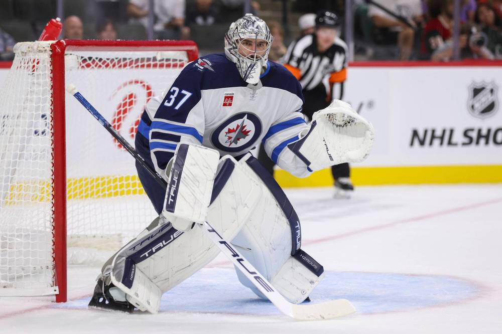 Bailey Hillesheim / The Associated Press
It was not a night to remember for Jets goalie Connor Hellebuyck against the Minnesota Wild.