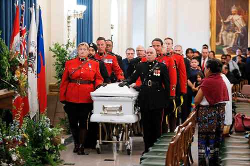 Family and friends escort the casket of Grand Chief Cathy Merrick for a ceremony and lying in state at the Legislature in Winnipeg on Wednesday, September 11, 2024. THE CANADIAN PRESS/John Woods