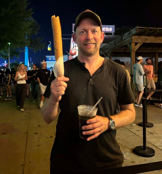 Someone is way too excited about a way-too-large corn dog. (Frances Sigurdson photo)