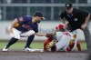 Houston Astros second baseman Jose Altuve, left, catches Los Angeles Angels' Jack López (10) who was trying to steal as umpire Rob Drake, top right, watches for a call during the third inning of a baseball game Sunday, Sept. 22, 2024, in Houston. (AP Photo/Kevin M. Cox)