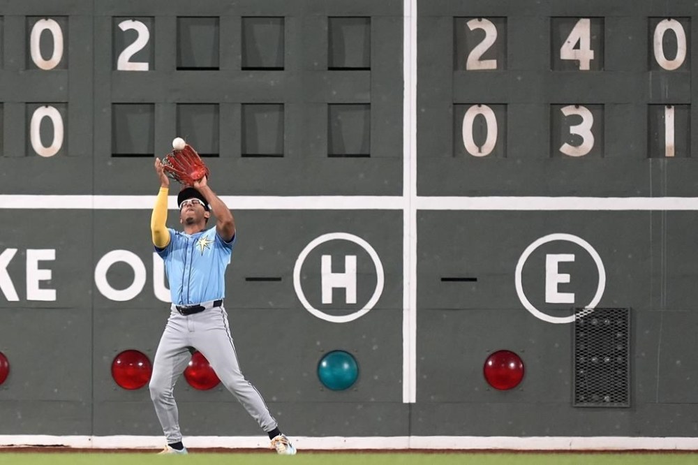 Tampa Bay Rays left fielder Richie Palacios catches a flyout by Boston Red Sox's Masataka Yoshida during the seventh inning of a baseball game, Friday, Sept. 27, 2024, in Boston. (AP Photo/Michael Dwyer)