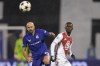 Dinamo's goalkeeper Ivan Filipovic, left, and Monaco's Folarin Balogun go for the ball during the Champions League soccer match between Dinamo Zagreb and Monaco at Maksimir stadium in Zagreb, Croatia, Wednesday, Oct. 2, 2024. (AP Photo/Darko Bandic)