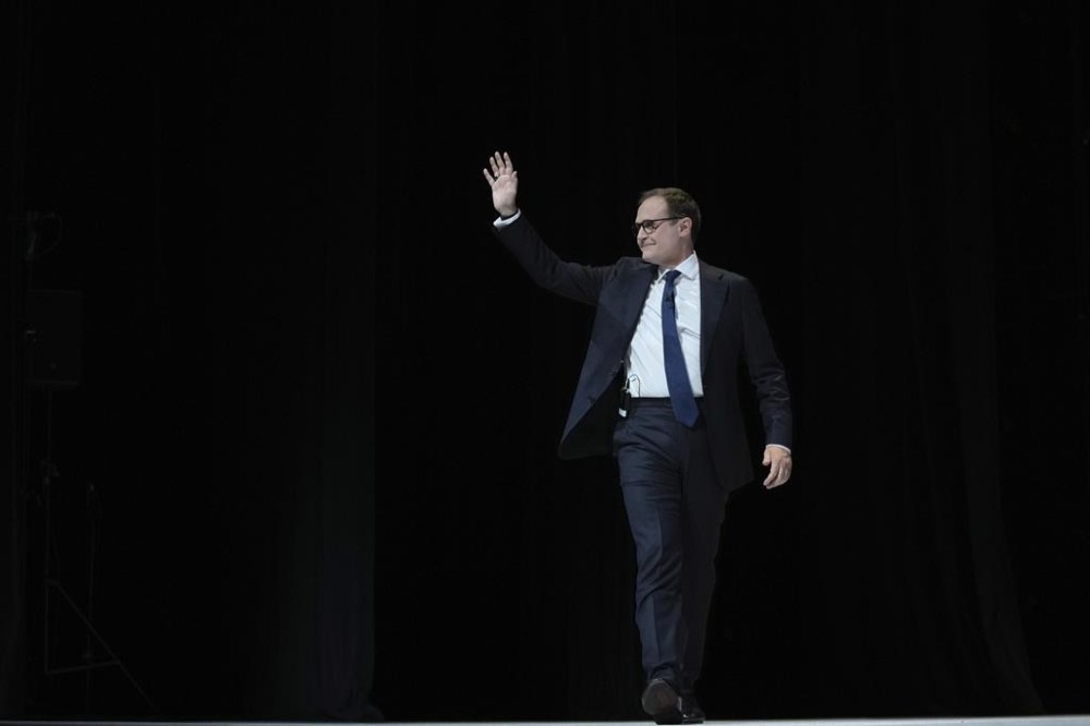 Conservative leadership candidate Tom Tugendhat waves to members during the Conservative Party Conference at the International Convention Centre in Birmingham, England, Wednesday, Oct. 2, 2024.(AP Photo/Kin Cheung)
