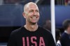FILE - United States head coach Gregg Berhalter smiles from the bench before a CONCACAF Nations League final soccer match against Mexico, Sunday, March 24, 2024, in Arlington, Texas. (AP Photo/Tony Gutierrez )