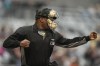 FILE - An umpire signals for a strikeout after being told a strike call through an earpiece during the first inning of a minor league baseball game between the St. Paul Saints and the Nashville Sounds, Friday, May 5, 2023, in St. Paul, Minn. (AP Photo/Abbie Parr, File)