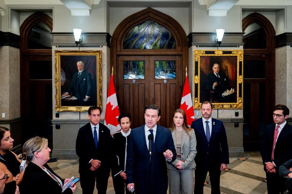 Conservative Leader Pierre Poilievre speaks in the Foyer of the House of Commons on Parliament Hill in Ottawa, on Tuesday, Oct. 8, 2024. THE CANADIAN PRESS/Spencer Colby