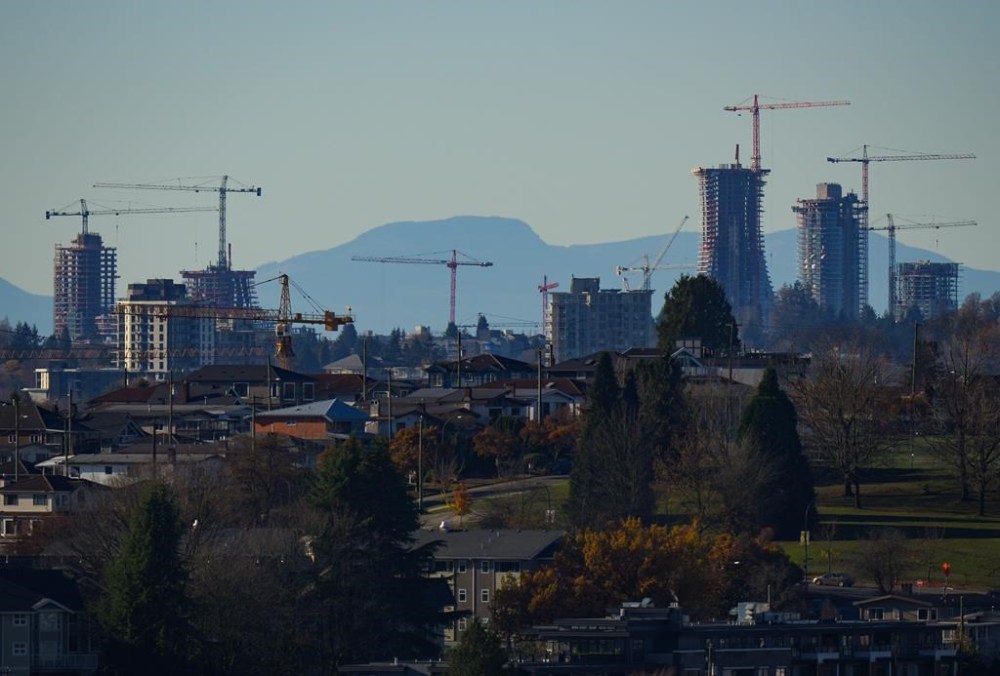 Construction cranes dot the skyline as condo towers are seen under construction at the Oakridge Park shopping centre redevelopment, in Vancouver, B.C., Thursday, Nov. 23, 2023. THE CANADIAN PRESS/Darryl Dyck