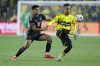 Columbus Crew's Mohamed Farsi, right, kicks the ball away from Inter Miami's Diego Gomez during the first half of an MLS soccer match Wednesday, Oct. 2, 2024, in Columbus, Ohio. (AP Photo/Jay LaPrete)