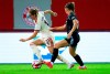 Munich's Sydney Lohmann, left, and Arsenal's Katie McCabe, right, challenge for the ball during the women's Champions League group C soccer match between FC Bayern Munich and Arsenal Women FC in Munich, Germany, Wednesday, Oct. 9, 2024. (Sven Hoppe/dpa via AP)