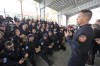 Miami-Dade Fire Rescue's Urban Search and Rescue Florida Task Force One leader Brandon Webb, right, addresses members of the task force before they deploy ahead of Hurricane Milton, Wednesday, Oct. 9, 2024, in Doral, Fla. (AP Photo/Wilfredo Lee)