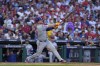 New York Mets' Pete Alonso follows through after hitting a home run against Philadelphia Phillies pitcher José Ruiz during the sixth inning of Game 2 of a baseball NL Division Series, Sunday, Oct. 6, 2024, in Philadelphia. (AP Photo/Matt Slocum)