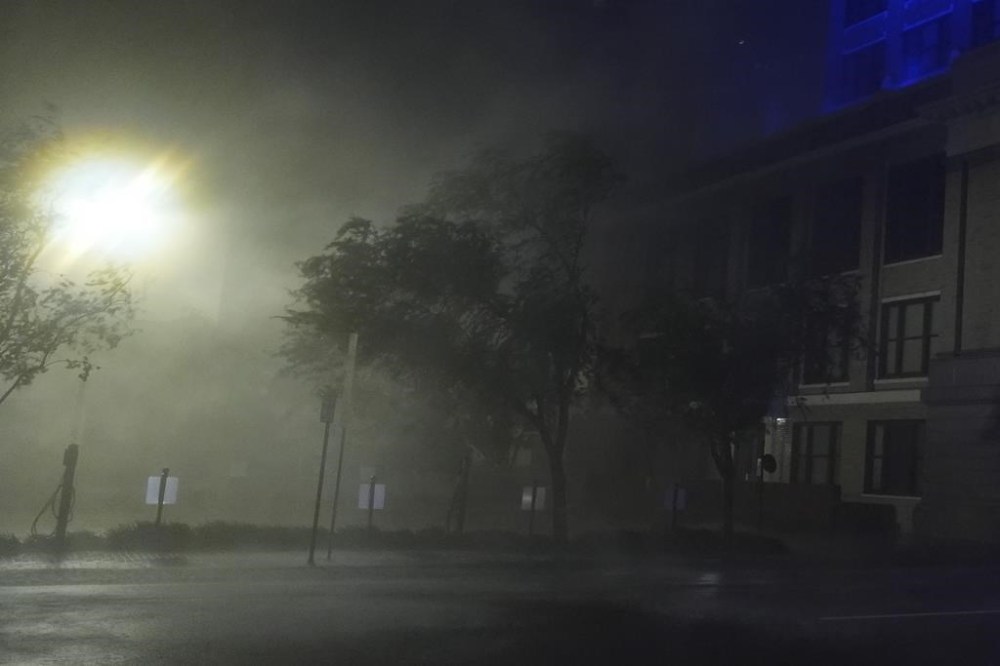 Wind-driven rain soaks a street in downtown Tampa, Fla., during the passage of Hurricane Milton, Wednesday, Oct. 9, 2024. (AP Photo/Rebecca Blackwell)