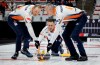 Team Gushue skip Brad Gushue, centre, delivers a stone as lead Geoff Walker, left, and second E.J. Harnden sweep against Team McEwen during the men's curling final at the PointsBet Invitational in Calgary on Sunday, Sept. 29, 2024. Team Brad Gushue says the rink and second E.J. Harnden are parting ways. THE CANADIAN PRESS/Jeff McIntosh