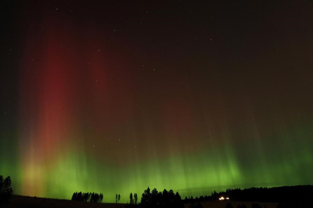 An aurora borealis, also known as the northern lights, is seen in the night sky along with the Big Dipper constellation on Thursday, Oct. 10, 2024, in Moscow, Idaho. (AP Photo/Ted S. Warren)