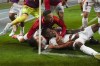 Peru's Miguel Araujo, bottom, celebrates scoring his side's opening goal against Uruguay during a qualifying soccer match for the FIFA World Cup 2026 at National Stadium in Lima, Peru, Friday, Oct. 11, 2024. (AP Photo/Guadalupe Pardo)