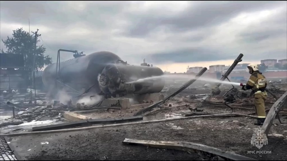 In this photo taken from video released by Russian Emergency Ministry Press Service on Saturday, Oct. 12, 2024, firefighters extinguish a large fire after an explosion at a gas station in Grozny, the capital of Chechen republic of Russia, which killed at least four people. (Russian Emergency Ministry Press Service via AP)