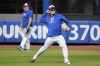 New York Mets pitcher Kodai Senga shags balls in the outfield before Game 3 of the National League baseball playoff series against the Philadelphia Phillies, Tuesday, Oct. 8, 2024, in New York. (AP Photo/Frank Franklin II)
