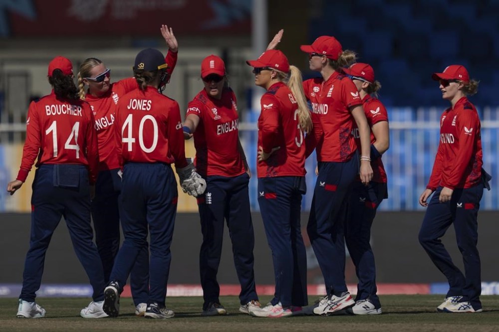 England players celebrate the wicket of Scotland's Sarah Bryce during the ICC Women's T20 World Cup 2024 match between England and Scotland at Sharjah Stadium, United Arab Emirates, Sunday, Oct. 13, 2024. (AP Photo/Altaf Qadri)