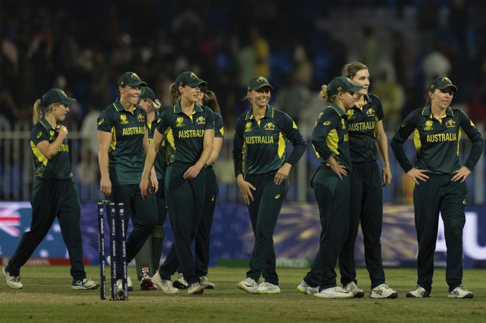 Australia's players celebrates their win against India during the ICC Women's T20 World Cup 2024 match at Sharjah Stadium, United Arab Emirates, Sunday, Oct. 13, 2024. (AP Photo/Altaf Qadri)