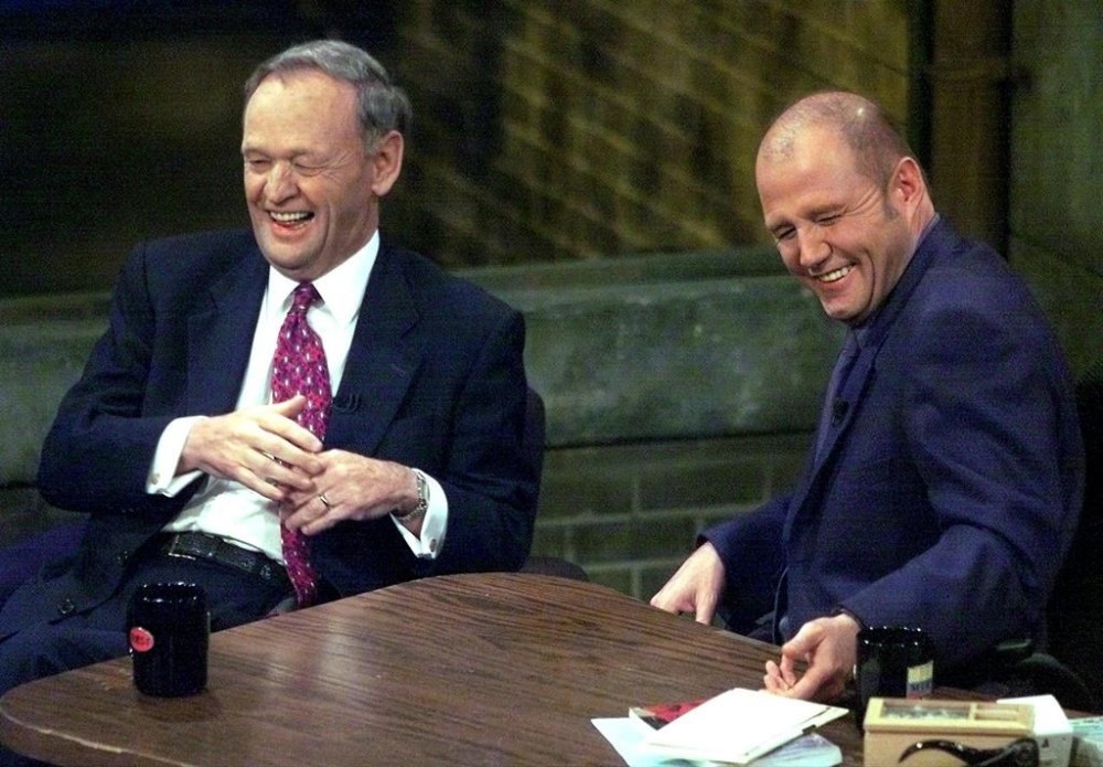 Canadian standup comedian and broadcaster Mike Bullard has passed away, his family confirmed Sunday. Prime Minister Jean Chretien, left, and Bullard laugh during the taping of Open Mike with Mike Bullard in Toronto on Thursday May 17, 2001. THE CANADIAN PRESS/Frank Gunn
