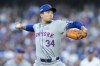New York Mets pitcher Kodai Senga throws against the Los Angeles Dodgers during the first inning in Game 1 of a baseball NL Championship Series, Sunday, Oct. 13, 2024, in Los Angeles. (AP Photo/Ashley Landis)