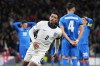 England's Jude Bellingham celebrates after scoring his side's first goal during the UEFA Nations League Group F soccer match between England and Greece at Wembley Stadium in London, Thursday, Oct. 10, 2024. (AP Photo/Kirsty Wigglesworth)