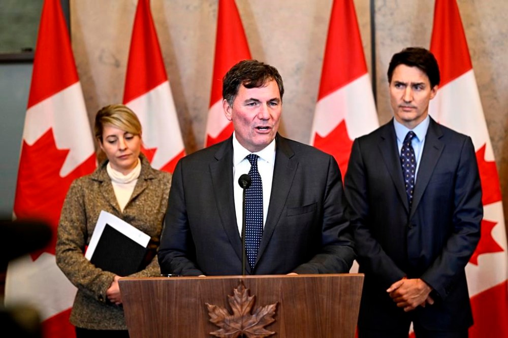 Minister of Public Safety, Democratic Institutions and Intergovernmental Affairs Dominic LeBlanc, centre, Prime Minister Justin Trudeau, right, and Minister of Foreign Affairs Melanie Joly participate in a news conference on the investigative efforts related to violent criminal activity occurring in Canada with connections to India, on Parliament Hill in Ottawa, on Monday, Oct. 14, 2024. The public safety minister is expected to testify at a federal inquiry into foreign interference just one day after announcing explosive allegations about crimes of murder, coercion and extortion in Canada linked to agents of the Indian government. THE CANADIAN PRESS/Justin Tang