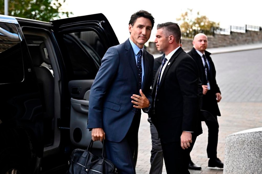 Prime Minister Justin Trudeau exits his vehicle as he arrives for a news conference on the investigative efforts related to violent criminal activity occurring in Canada with connections to India, on Parliament Hill in Ottawa, on Monday, Oct. 14, 2024. THE CANADIAN PRESS/Justin Tang