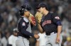 Cleveland Guardians pitcher Joey Cantillo, right, talks with catcher Bo Naylor during the third inning in Game 1 of the baseball AL Championship Series against the New York Yankees Monday, Oct. 14, 2024, in New York. (AP Photo/Godofredo Vásquez)