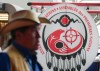 First Nations chiefs are gathered in Calgary today as they prepare to vote on a landmark $47.8-billion child welfare reform agreement with Ottawa.An attendee walks past a banner at the Assembly of First Nations annual general assembly in Montreal, Tuesday, July 9, 2024. THE CANADIAN PRESS/Christinne Muschi