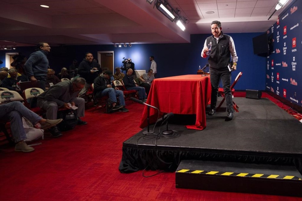Philadelphia Phillies manager Rob Thomson, right, looks on after speaking to the media during an end of the season baseball news conference, Tuesday, Oct. 15, 2024, in Philadelphia. (AP Photo/Chris Szagola)