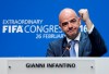 FILE - Newly elected FIFA president Gianni Infantino of Switzerland raises an arm during a press conference in Zurich, Switzerland, Feb. 26, 2016. (AP Photo/Michael Probst, File)
