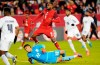 Canada's Cyle Larin (9) watches the ball sail into the net as he scores on Panama goalkeeper Orlando Mosquera (22) during first half men's international friendly soccer action in Toronto, on Tuesday, Oct. 15, 2024. THE CANADIAN PRESS/Frank Gunn
