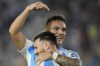 Argentina's Lautaro Martinez, celebrates with teammate Lionel Messi after scoring his side's 2nd goal against Bolivia during a World Cup 2026 qualifying soccer match at Monumental stadium in Buenos Aires, Argentina, Tuesday, Oct. 15, 2024. (AP Photo/Natacha Pisarenko)