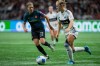 Portland Thorns FC's Christine Sinclair (12) and Vancouver Whitecaps' Tea Mayson, right, vie for the ball during the first half of a CONCACAF W Champions Cup match in Vancouver, on Tuesday, Oct. 15, 2024. THE CANADIAN PRESS/Ethan Cairns