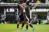 Mexico's Raúl Jiménez, right, is congratulated by Edson Álvarez after scoring his side's opening goal against the United States during an international friendly soccer match at Akron Stadium in Guadalajara, Mexico, Tuesday, Oct. 15, 2024. (AP Photo/Eduardo Verdugo)
