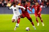 Panama's Kahiser Lenis (26) and Canada's Alphonso Davies (19) battle for the ball during first half men's international friendly soccer action in Toronto, on Tuesday, Oct. 15, 2024. Canada will face Suriname in next month's two-legged CONCACAF Nations League quarterfinal. THE CANADIAN PRESS/Frank Gunn