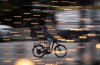 A food delivery worker rides a bike in downtown Vancouver, B.C., Dec. 23, 2021. THE CANADIAN PRESS/Darryl Dyck