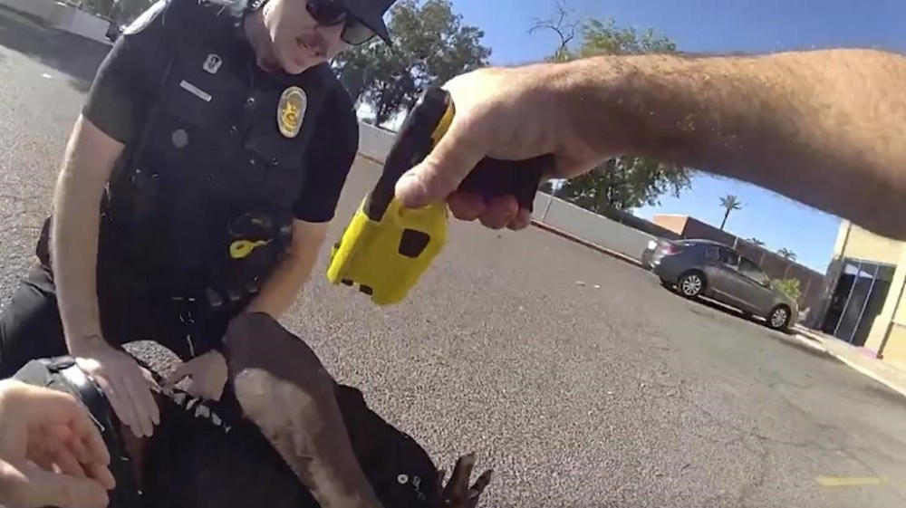 This image from Phoenix Police Department body camera footage from Aug. 19, 2024, shows Tyron Scott McAlpin, a Black man who is deaf, being punched and shocked with a Taser by Phoenix police officers when they responded to a call that the man had committed an assault at a convenience store in Phoenix. (Phoenix Police Department via AP)