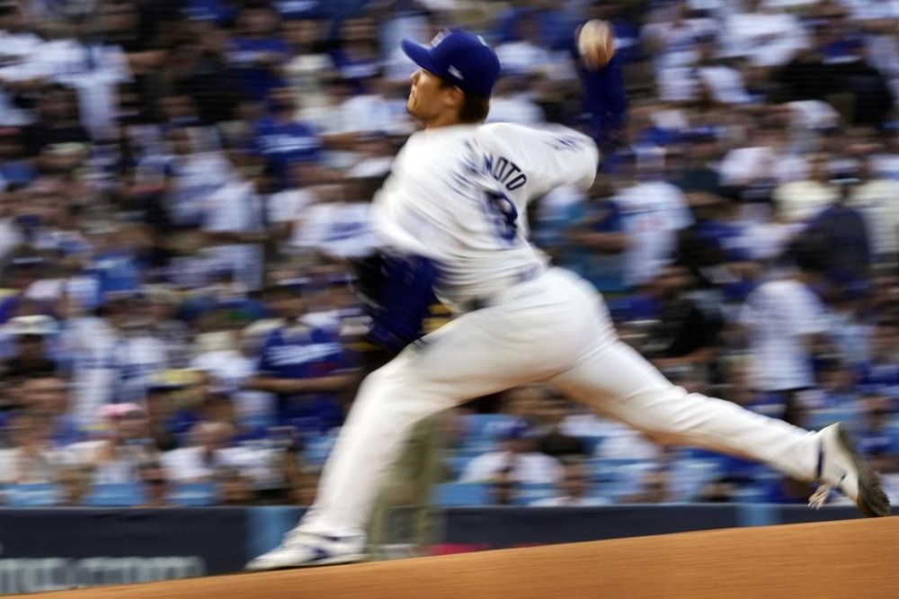 Los Angeles Dodgers starting pitcher Yoshinobu Yamamoto throws to a San Diego Padres batter during the first inning in Game 5 of a baseball NL Division Series Friday, Oct. 11, 2024, in Los Angeles. (AP Photo/Mark J. Terrill)