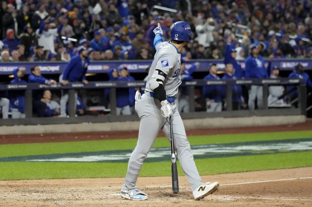 Los Angeles Dodgers' Shohei Ohtani celebrates his three-run home run against the New York Mets during the eighth inning in Game 3 of a baseball NL Championship Series, Wednesday, Oct. 16, 2024, in New York. (AP Photo/Ashley Landis)
