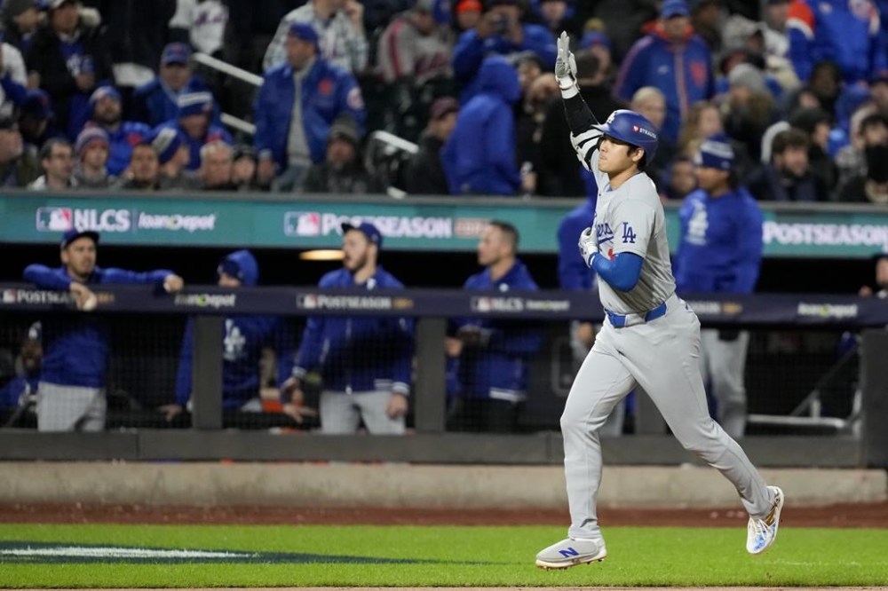 Los Angeles Dodgers' Shohei Ohtani celebrates his three-run home run against the New York Mets during the eighth inning in Game 3 of a baseball NL Championship Series, Wednesday, Oct. 16, 2024, in New York. (AP Photo/Ashley Landis)
