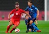 Canada's Desiree Scott dribbles the ball against Japan's Emi Nakajima during a women's soccer match at the 2020 Summer Olympics, Wednesday, July 21, 2021, in Sapporo, Japan. Scott, a hard-nosed defensive midfielder who won 187 caps for Canada, has announced she is retiring at the end of the NWSL season. THE CANADIAN PRESS/AP-Silvia Izquierdo