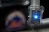 A blue LED light hangs from a railing in the grandstand during Game 4 of the National League baseball playoff series between the New York Mets and the Philadelphia Phillies, Wednesday, Oct. 9, 2024, in New York. (AP Photo/Frank Franklin II)