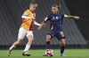 Galatasaray's Ebru Topcu, left, tussles for the ball with Roma's Manuela Giugliano during the women's Champions League group A soccer match between Galatasaray and Roma at Ataturk Olympic stadium in Istanbul, Turkey, Thursday, Oct. 17, 2024. (Huseyin Yavuz/Dia Photo via AP)