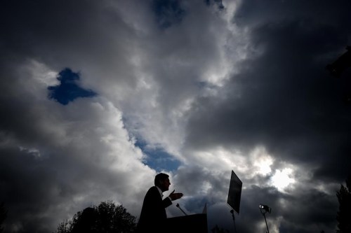 B.C. NDP Leader David Eby is silhouetted while speaking during a campaign stop in Vancouver, on Oct. 17. British Columbia's election campaign enters its final day in what is viewed as a too-close-to-call contest. THE CANADIAN PRESS/Darryl Dyck