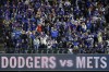 Fans cheer before Game 4 of a baseball NL Championship Series between the Los Angeles Dodgers and the New York Mets, Thursday, Oct. 17, 2024, in New York. (AP Photo/Frank Franklin II)