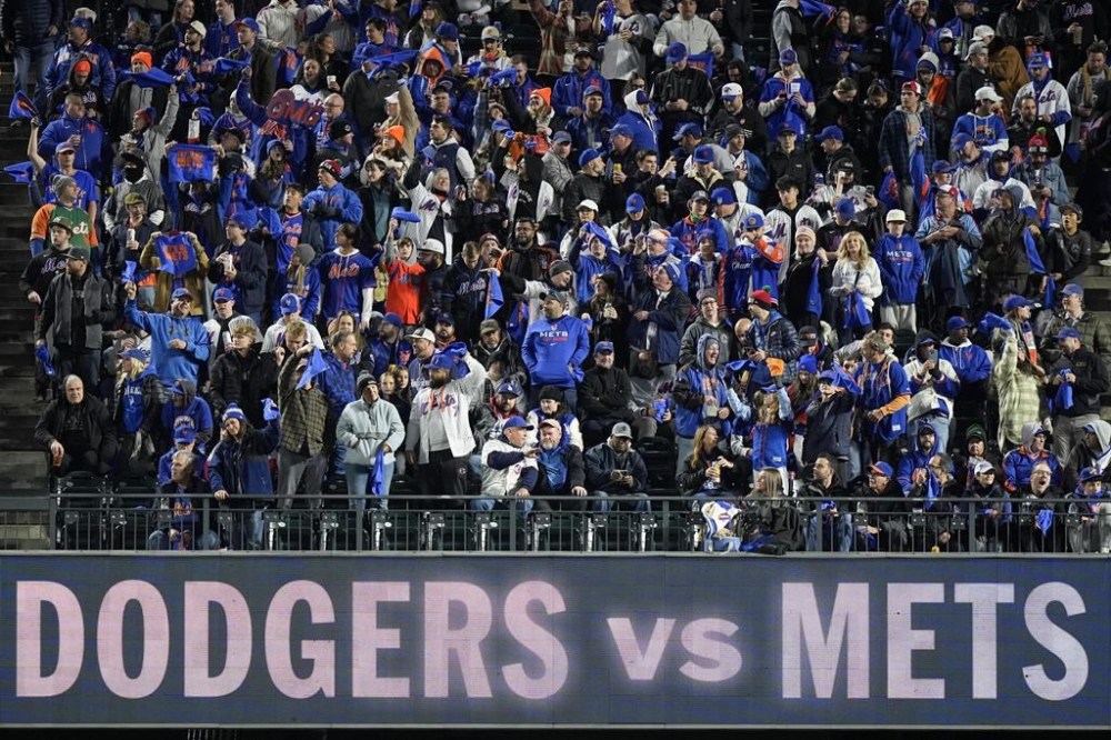 Fans cheer before Game 4 of a baseball NL Championship Series between the Los Angeles Dodgers and the New York Mets, Thursday, Oct. 17, 2024, in New York. (AP Photo/Frank Franklin II)